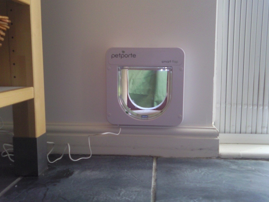 Petporte electronic microchip reading cat flap fitted in external wall