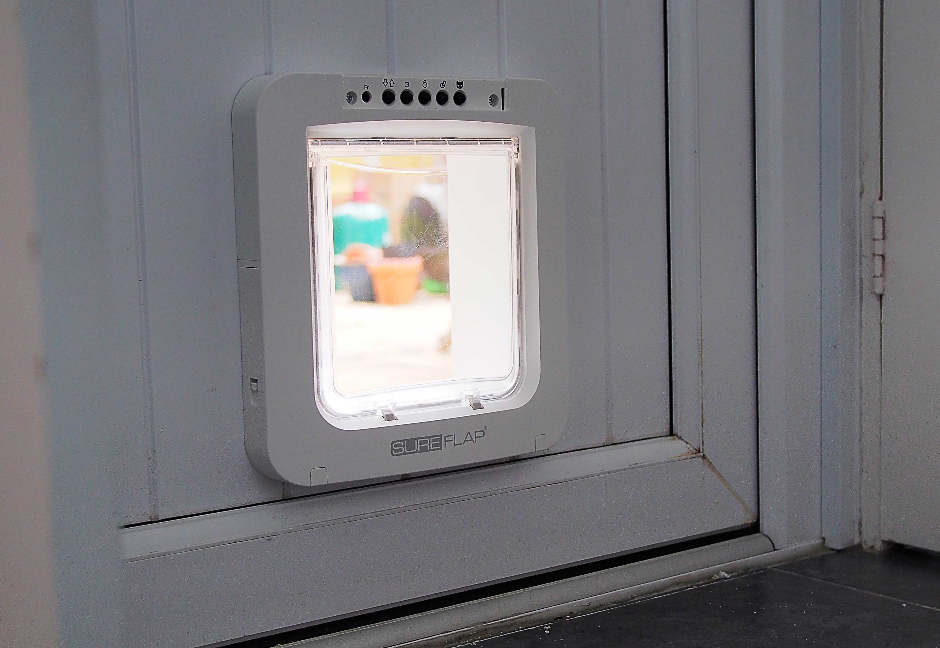Sureflap microchip reading pet door fitted in a UPVC panel