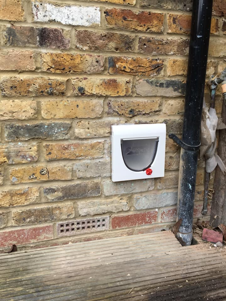 Cat flap fitted in a 1920's weathered, brick home.