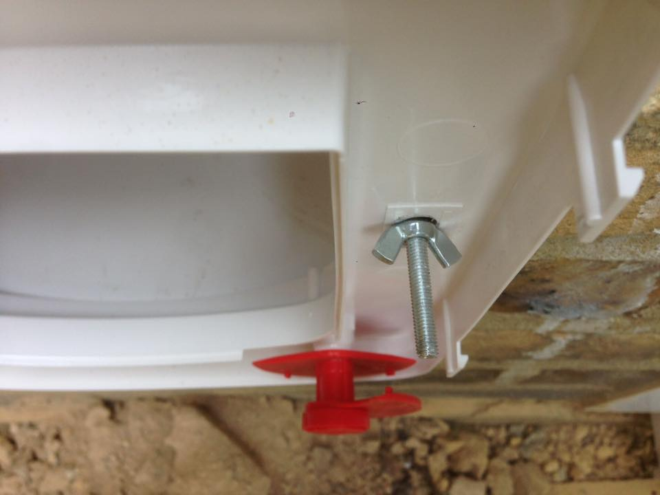 Wing nut sercuring cat flap to wall